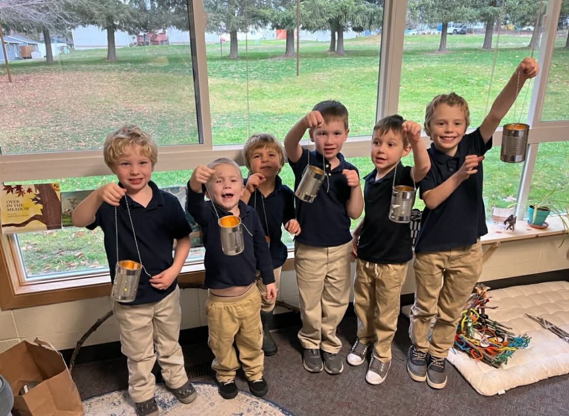 Students showing off their craft projects