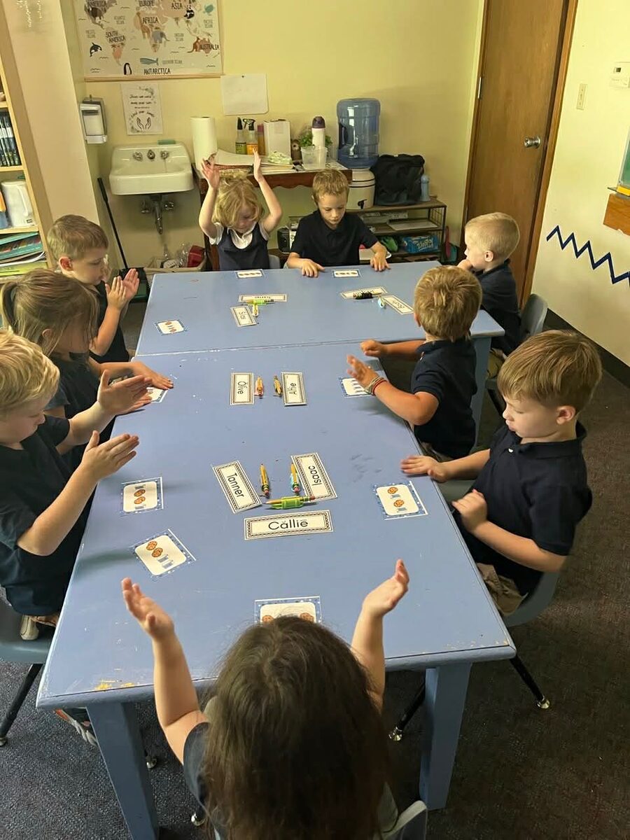 Kindergarten students playing a learning game together