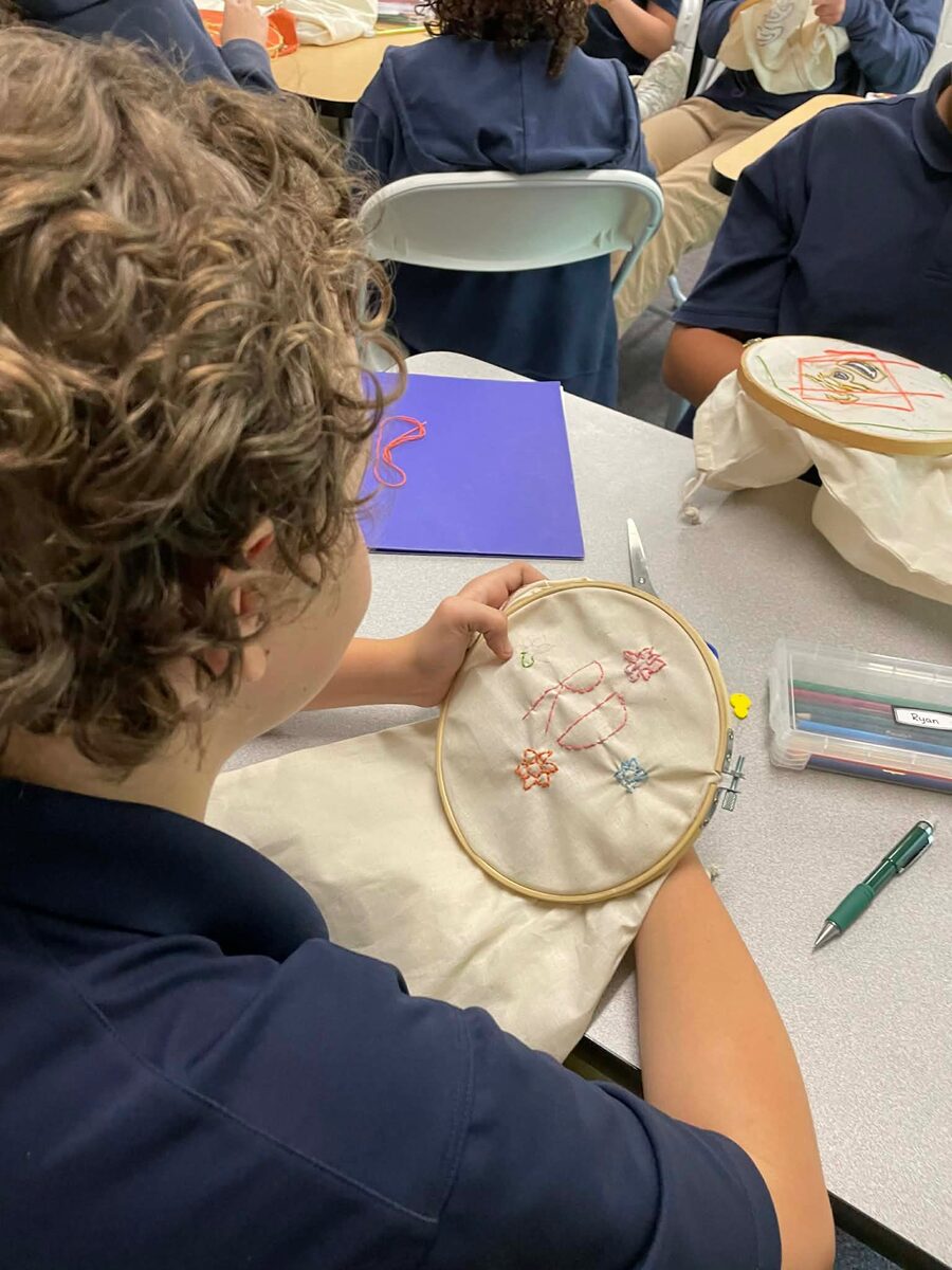 Student working on embroidery
